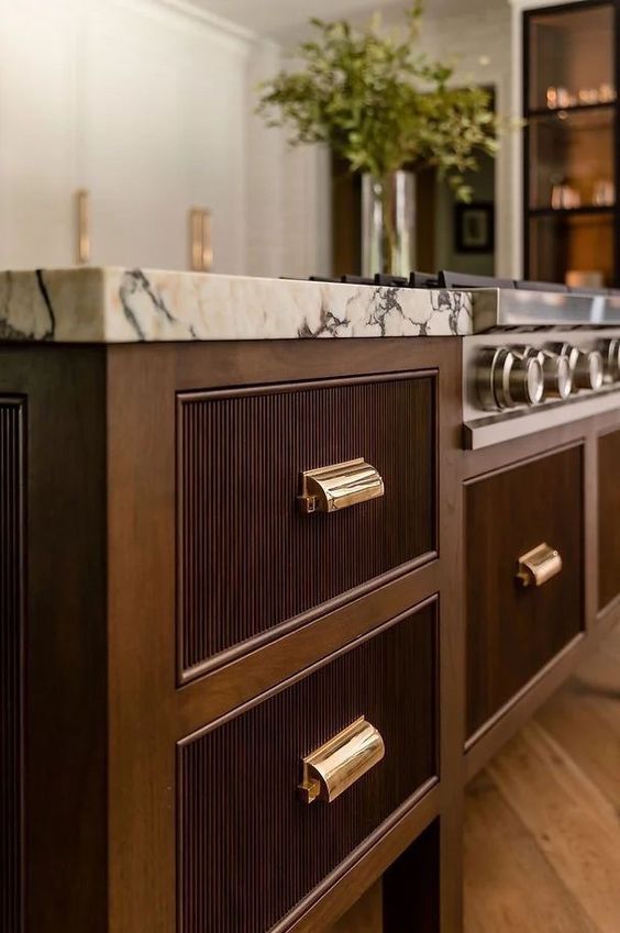 Luxury kitchen island with marble and brass hardware in Toronto