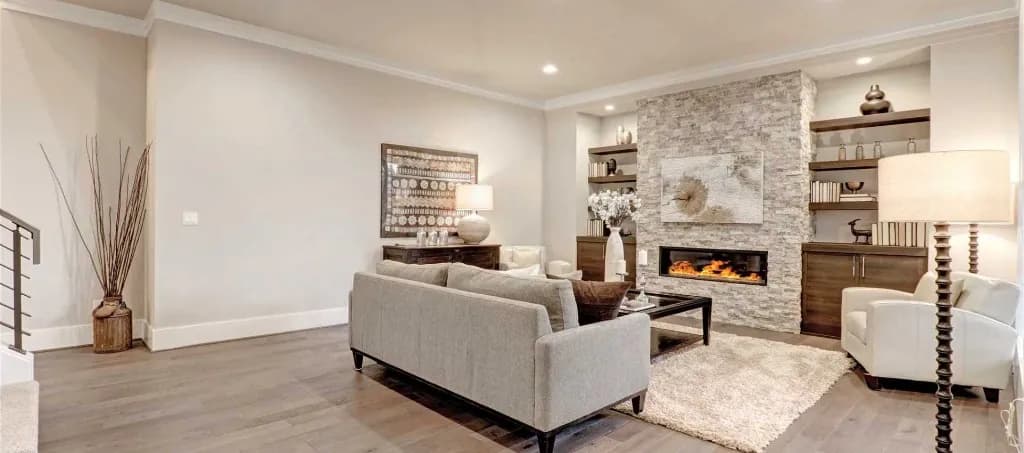 Finished basement family room with stacked stone fireplace and built-in cabinetry in Midtown, Toronto